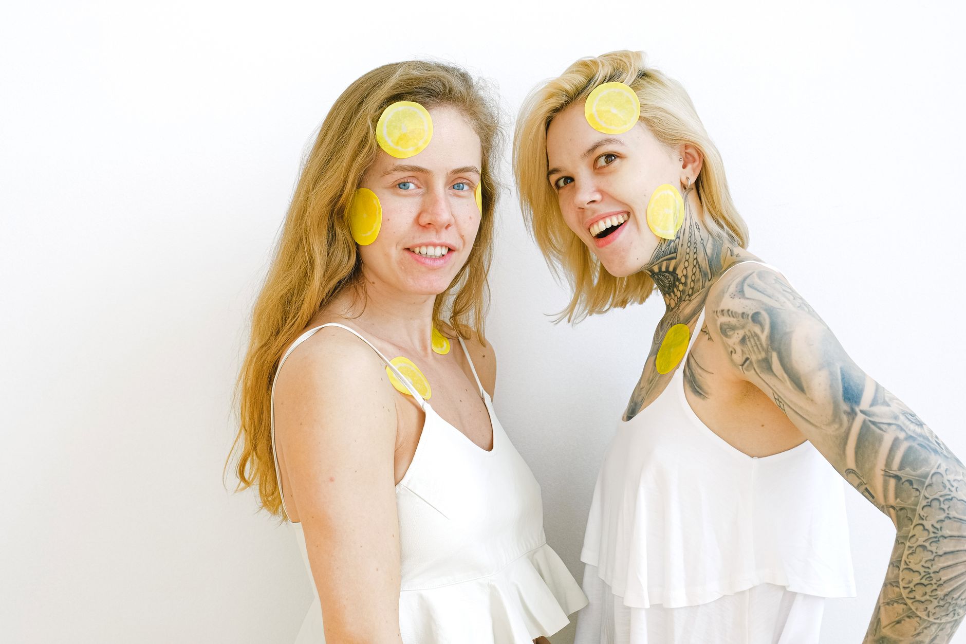 Two women laughing together, symbolizing joy and connection in intimate relationships